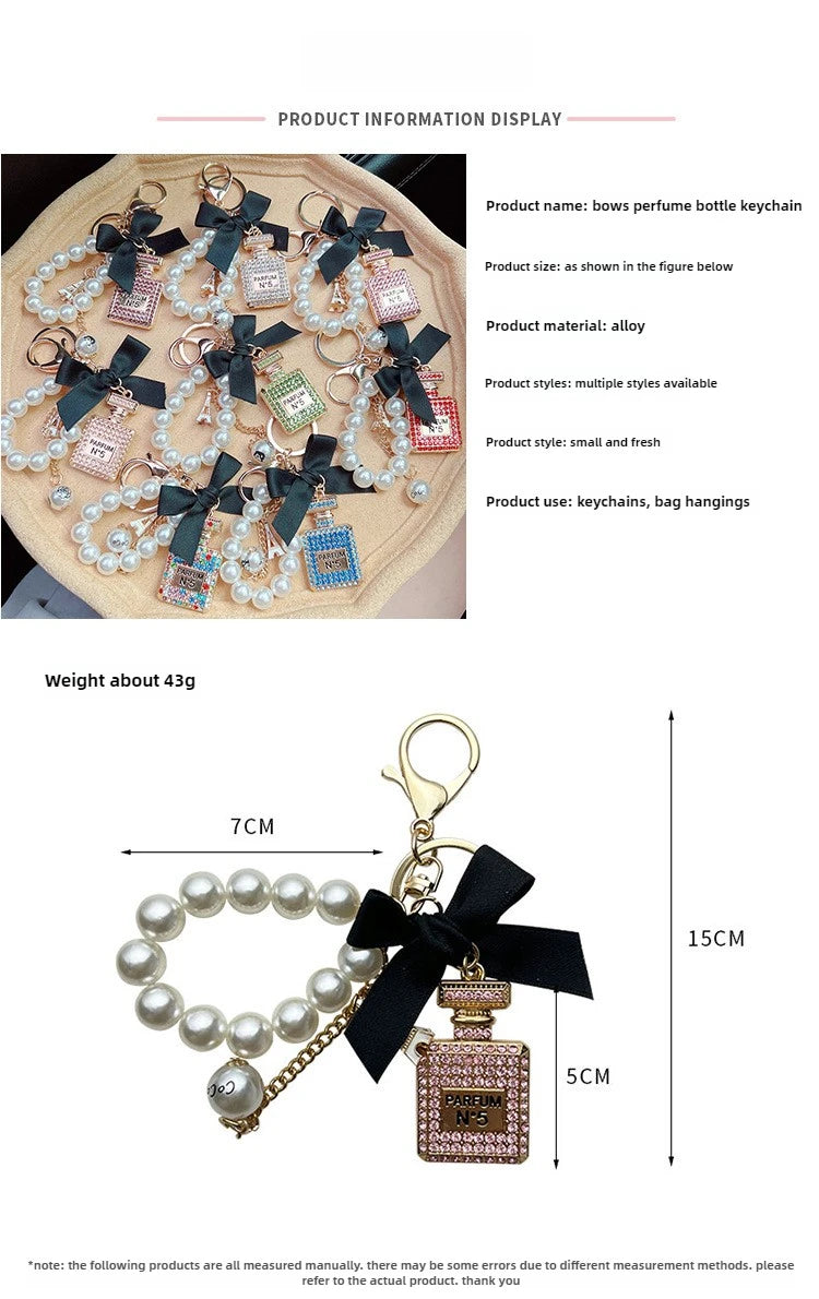Alloy diamond inlaid bow shaped perfume bottle key chain creative pearl chain bag pendant exquisite key chain